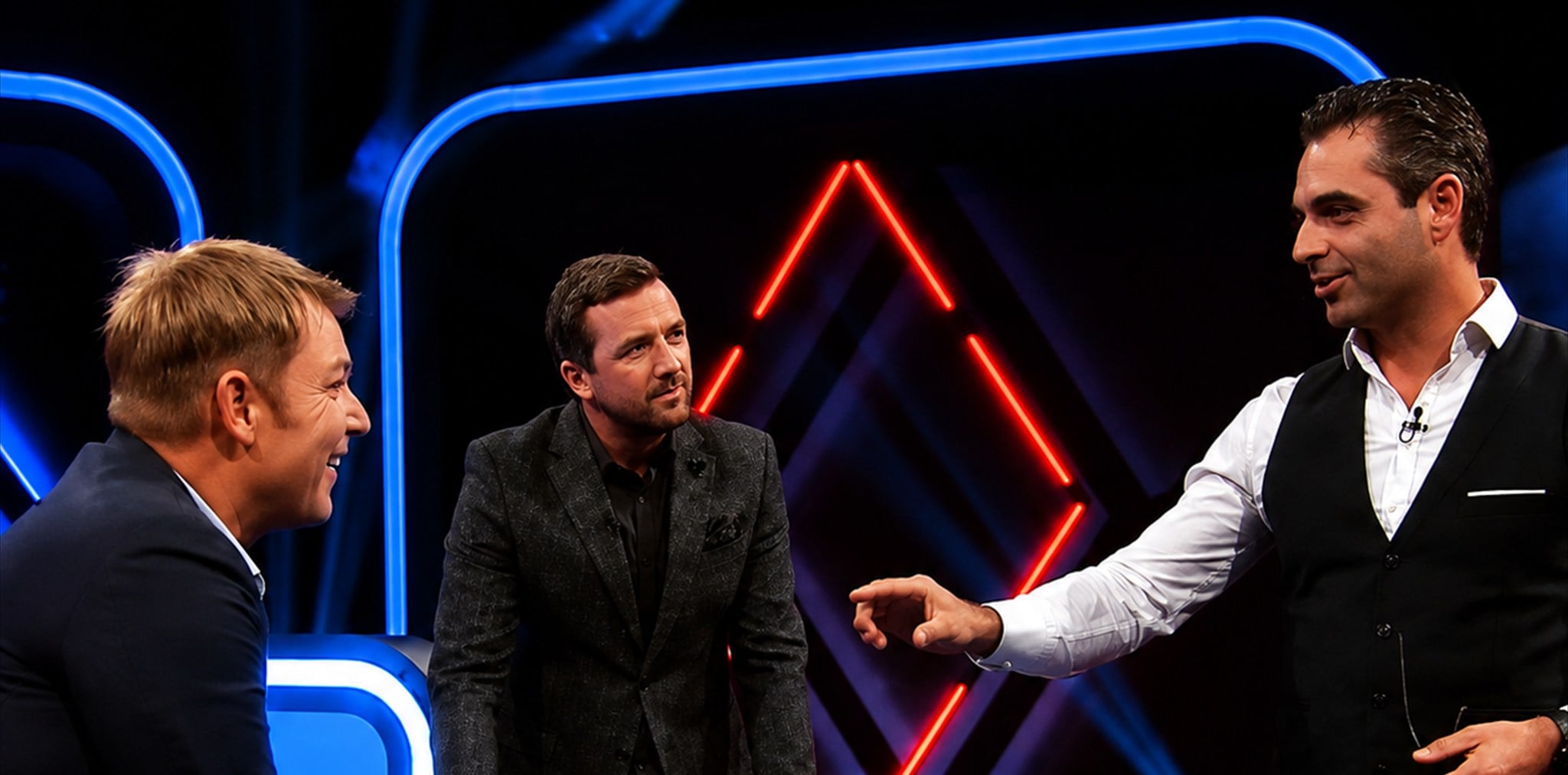 Phoenix reading a guest’s mind on a television set, giant ESP symbols glowing on the studio screen behind them